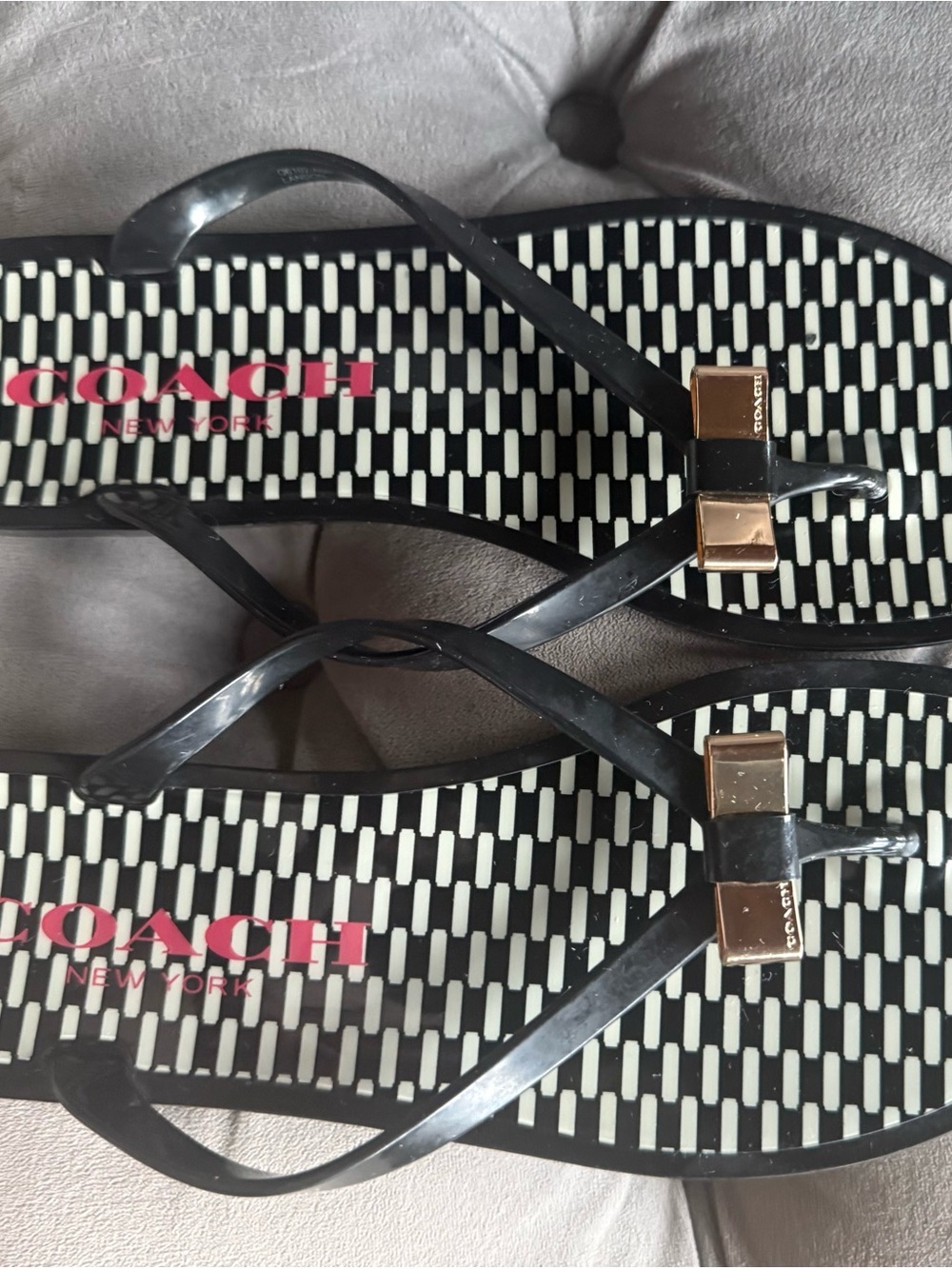 Coach Black Flip Flop Sandals with Gold Accents and Pink Logo